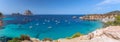 Panorama of Cala Hort with sea sailing yachts and the mountain Es Vedra. Ibiza, Balearic Islands, Spain Royalty Free Stock Photo