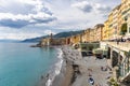 Panorama of the Camogli coast and beach with people. Little fishing village and resort close to the peninsula of Portofino