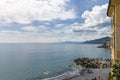 Panorama of the Camogli coast and beach with people. Little fishing village and resort close to the peninsula of Portofino