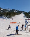 PANORAMA, CANADA - MARCH 21, 2019: Mountain Resort view early spring people skiing Royalty Free Stock Photo