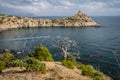 Panorama of cape Kapchik near coastline of Black Sea. Shape of mountain reminds sleeping animal, face turned to left Royalty Free Stock Photo