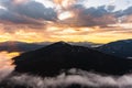 Panorama of the Carpathians in the Synevyrska Polyana Natural Park, forest with snow and morning fog and clouds, clouds Royalty Free Stock Photo