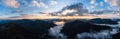 Panorama of the Carpathians in the Synevyrska Polyana Natural Park, forest with snow and morning fog and clouds, clouds Royalty Free Stock Photo