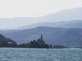 Panorama of catholic pilgrimage church Maria Woerth Rosenkranzkirche alpine mountain lake Woerthersee Carinthia Austria Royalty Free Stock Photo