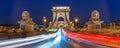 Panorama of Chain bridge at night with car light trails in Budapest Hungary Royalty Free Stock Photo