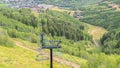 Panorama Chairlifts with amazing view of ski resort blanketed in greenery at off season Royalty Free Stock Photo