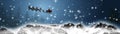 Panorama christmas - santa claus is flying with sleigh and reindeers over snowy mountains Royalty Free Stock Photo