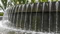 Panorama Circular water fountain pool against trees and Utah State Capital Building