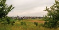 Panorama of the city in Germany. Houses in the valley. Cultivated fields under the city. Farm.
