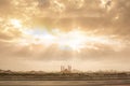 Panorama of the city of Nizwa and the mosque with cloudy sky and rays of light Royalty Free Stock Photo