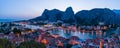 Panorama city Omis lit at sunset from Mirabella tower