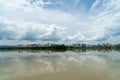 Panorama of city reflection in water under clouds during daytime Royalty Free Stock Photo