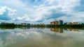 Panorama of city reflection in water under clouds during daytime Royalty Free Stock Photo