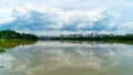 Panorama of city reflection in water under clouds during daytime Royalty Free Stock Photo