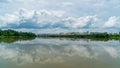 Panorama of city reflection in water under clouds during daytime Royalty Free Stock Photo