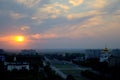 Panorama of the city of Tolyatti with a view of the Transfiguration Cathedral on the background of the sunset sky and clouds.