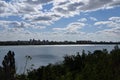 Panorama of the city. View of the reservoir. Overgrown banks. Royalty Free Stock Photo