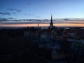 Panorama of the city wall towers and Oleviste church at the sunrise, Tallinn, Harjumaa, Estonia, March 2019 Royalty Free Stock Photo