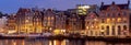 Panorama of the city waterfront of Amsterdam at sunset.