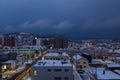 Panorama Cityscape night view of the Otaru city during cloudy morning and winter season, with roof building covered by snow in