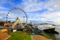 Panorama of ciy, pier, cruise ships in sea port Helsinki and ferris wheel. Royalty Free Stock Photo