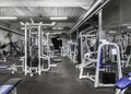 Panorama of a classic bright gym. White sport equipment and blue seats