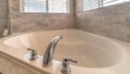 Panorama Clean built in bathtub with shiny faucet inside the bathroom of a home