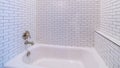 Panorama Clean white tiled shower combination tub bright interior