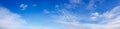 Panorama of clear blue sky with white cloud background. Clearing day and Good weather in the morning Royalty Free Stock Photo