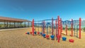 Panorama Climbing bars and steps playground equipment at a park against lake and mountain