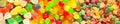 Panorama close up a background from colorful sweets of sugar can