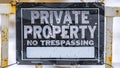 Panorama Close up view of a weathered sign that reads Private Property No Trespassing Royalty Free Stock Photo