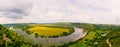 Panorama with clouds, river, fields.