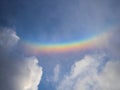 Panorama cloudscape view of natural colorful rainbow with white clouds and blue sky in Rotterdam Netherlands Europe