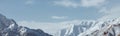 Panorama with cloudy sky and view of the Caucasus mountains Royalty Free Stock Photo