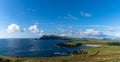 Panorama coastal landscape of the northern Dingle Peninsula with a view of Clogher Beach and the Dunurlin headland Royalty Free Stock Photo