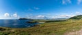 Panorama coastal landscape of the northern Dingle Peninsula with a view of Clogher Beach and the Dunurlin headland Royalty Free Stock Photo