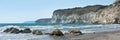 Panorama of coastline with limestone cliffs and sea waves at Kourion sand beach near Limassol, Cyprus