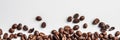 Panorama with coffee scattered on a white background