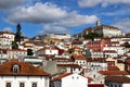 Panorama of Coimbra town, former medieval capital of Portugal. View of old colorful roofs and houses and university Royalty Free Stock Photo