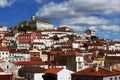 Panorama of Coimbra town, former medieval capital of Portugal. View of old colorful roofs and houses and university Royalty Free Stock Photo