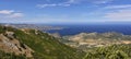Panorama from Col de Teghime, green hills and Mediterranean sea in the background, Landscape od Cap Corse in Corsica Royalty Free Stock Photo