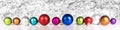 Colorful christmas balls in the row, white glitter background Royalty Free Stock Photo