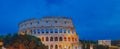 Panorama of Colosseum and Arch of Constantine under blue sky at dusk in Rome, Italy Royalty Free Stock Photo