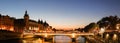 Panorama of Conciergerie and Illuminated bridge Pont au Change at night, Paris. Royalty Free Stock Photo