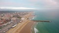 Panorama of Costa Caparica beach at evening aerial view