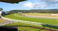 Panorama of a country Australian green grass horse race track wi