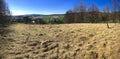 Panorama of country field with a barbed wire fence Royalty Free Stock Photo