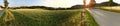 Panorama of country field at sunset with a speed bike Royalty Free Stock Photo