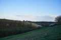 Panorama of the countryside at sunset in the evening light. Beautiful spring landscape in the mountains. Rural landscapes Royalty Free Stock Photo